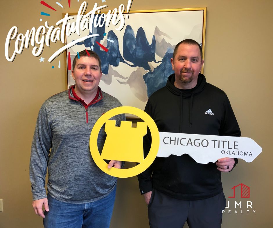 Photo of oklahoma city realtor jimmy hughes standing with a man who he recently helped successfully close a real estate deal.