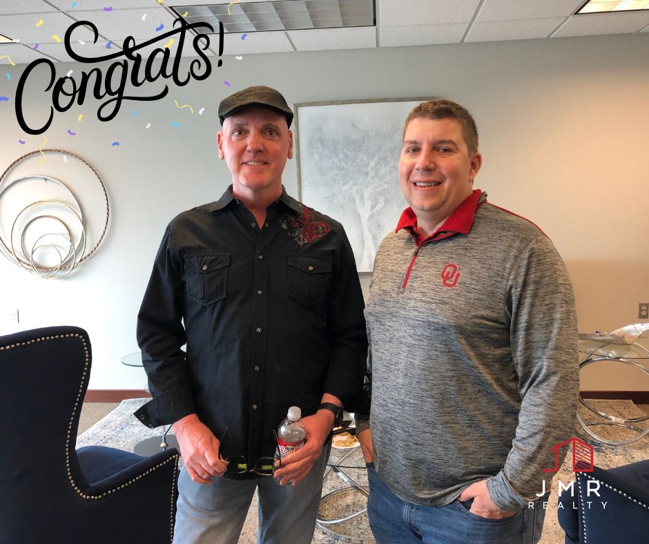 Photo of buyers agent Jimmy Hughes standing with a recent client