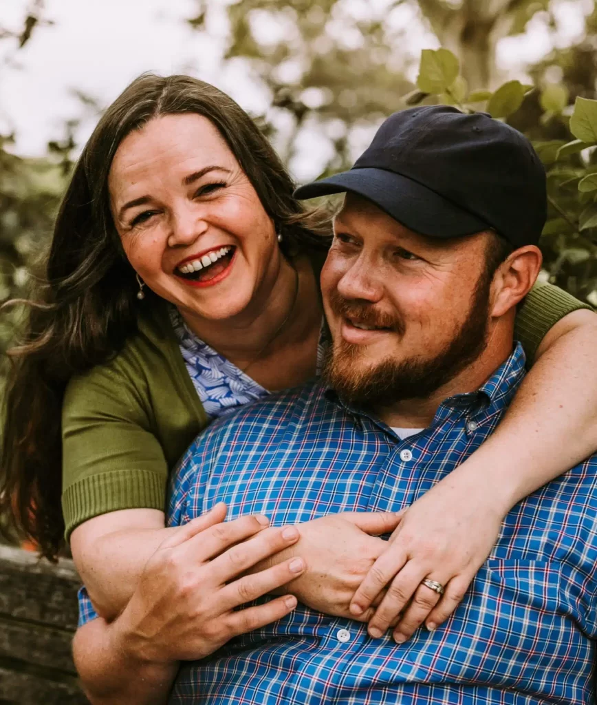 image of matt stone, owner of hometown painting, with his wife. They are smiling and he is wearing a blue plaid shirt. 