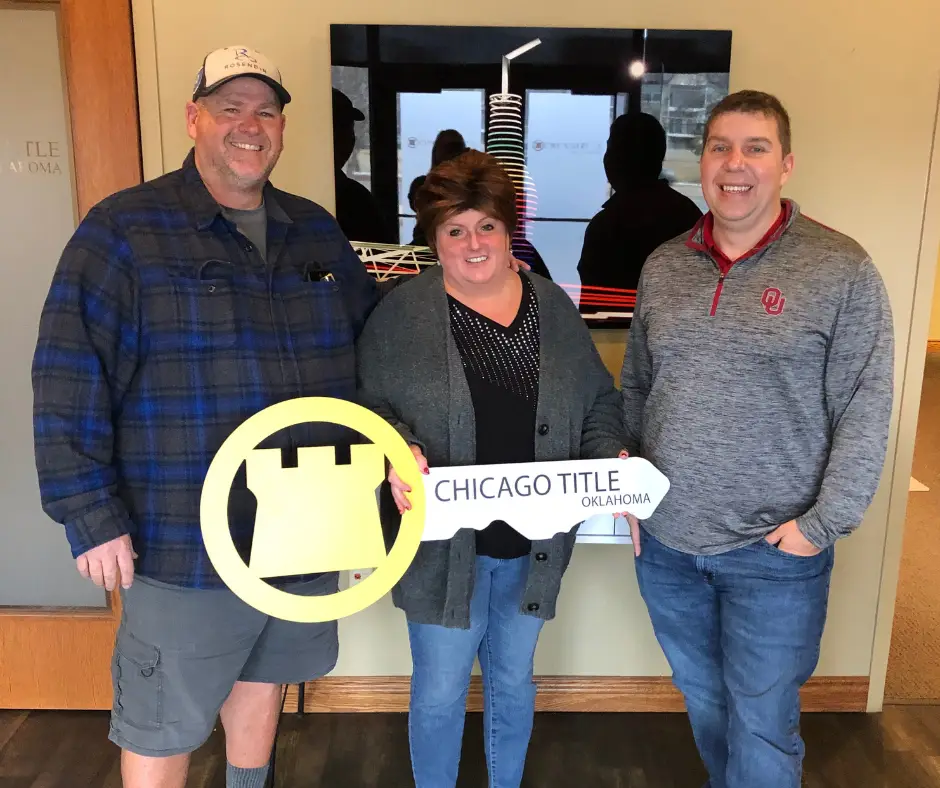 Buyer's Agent Jimmy Hughes with couple at home closing in Oklahoma City