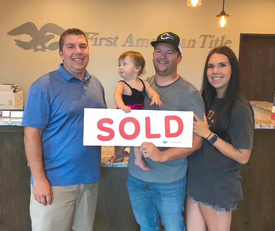 Family in Yukon, Oklahoma real estate closing with Jimmy Hughes