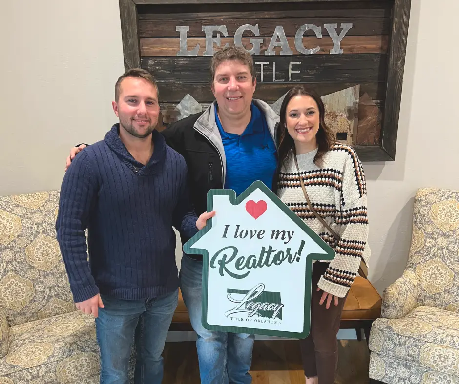 Jimmy Hughes real estate closing with happy couple